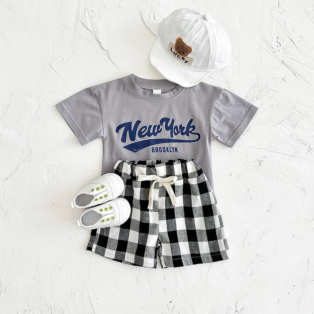 Neugeborene Babykleidung Set für Jungen und Mädchen, lässig, 2-teilig, mit Buchstaben bedrucktes Kurzarm-T-Shirt + karierte Shorts, Baby-Outfit 0-3 Jahre